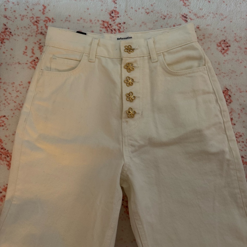 Reformation Cream High Rise Jeans with Gold Flower Buttons